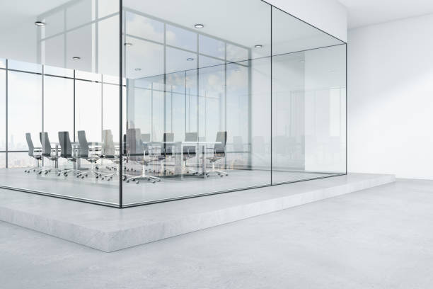 Modern glass office interior with city view, daylight, furniture and concrete flooring. Workplace concept. 3D Rendering. stock photo