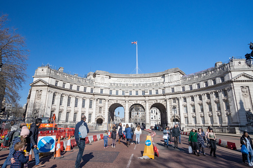 Tourists walking around Admiralty Arch on The Mall in City of Westminster, London