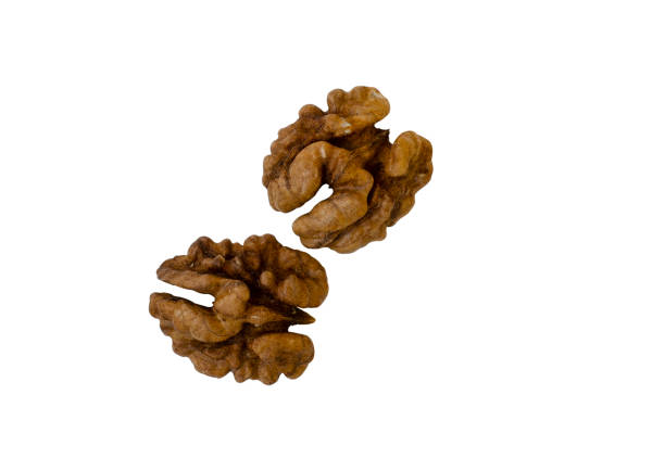 istock Walnuts. Bunch of peeled walnuts on a white background. Isolated image. 1387972613