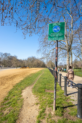 People walking along Rotten Row at Hyde Park in City of Westminster, London