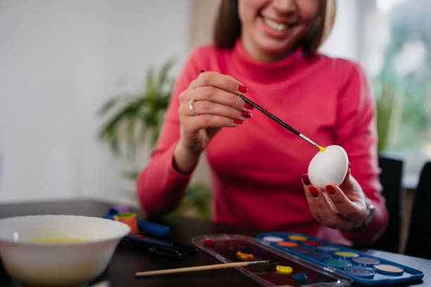 istock Family with colorful Easter eggs 1387974505
