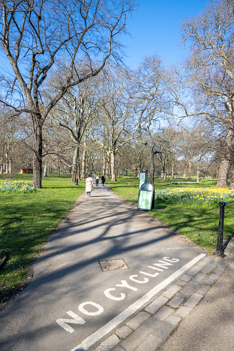 No Cycling Sign at Green Park in City of Westminster, London, with people in the background.