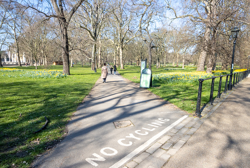 No Cycling Sign at Green Park in City of Westminster, London, with people in the background.