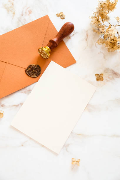 istock Autumn flat lay composition with wedding invitation card mockup, envelopes, dried flowers on marble table. 1387977326
