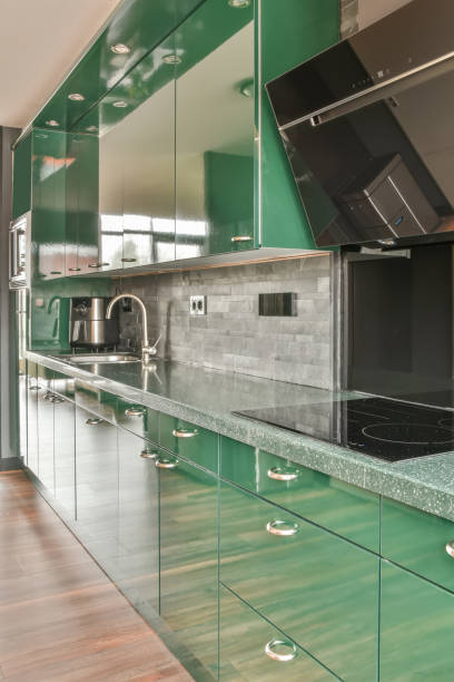 istock Kitchen in green design with modern appliances 1387978055