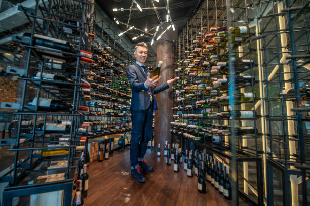 istock A male client choosing wina in a wine store 1387978591