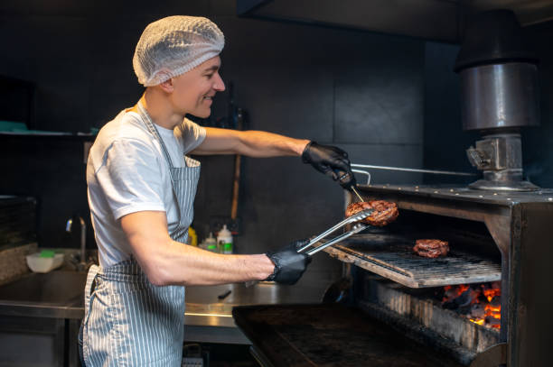 istock A chief-cooker working in the kitchen in the restaurant 1387978619