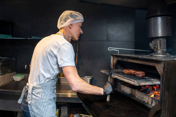 istock A chief-cooker working in the kitchen in the restaurant 1387978621