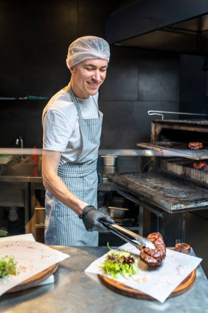 istock A chief-cooker working in the kitchen in the restaurant 1387978625