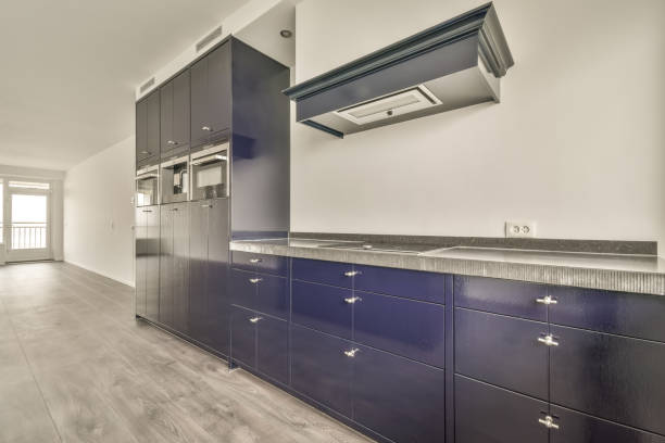 istock Small kitchen with blue furniture 1387978727