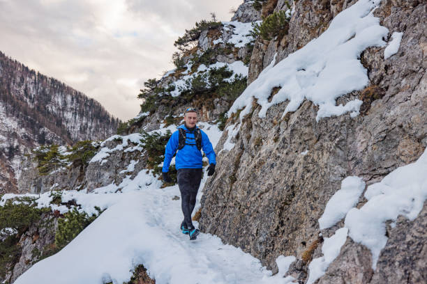 istock A Caucasian Trail Runner Taking A Run On A Snowy Mountain Path 1387979427