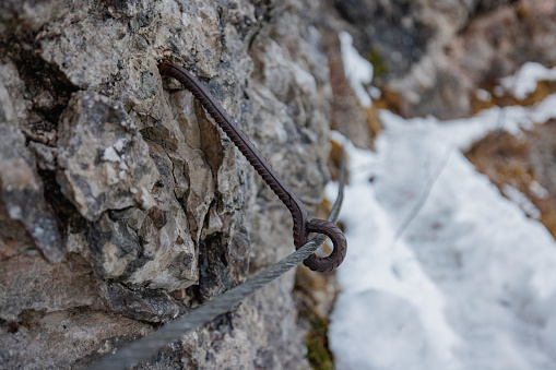 Close up of a fixed rope route on mountain ridge.