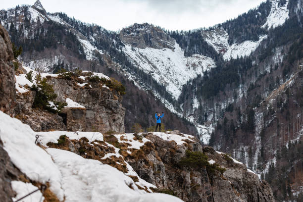 istock A Caucasian Trail Runner Pauses At Mountain Top In Winter 1387979440