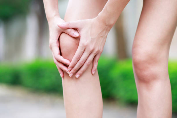 istock Runner touching painful twisted or broken. Athlete training accident. Sport running sprained sprain cause injury knee. and pain with leg bones. 1387980611