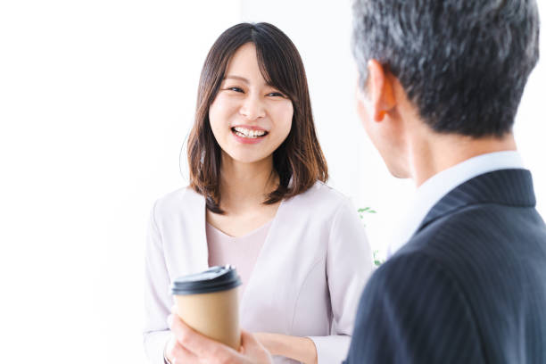 career woman talking to her boss over coffee - respect japan business togetherness imagens e fotografias de stock
