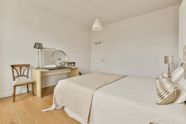 istock A bedroom with a large white bed 1387985176
