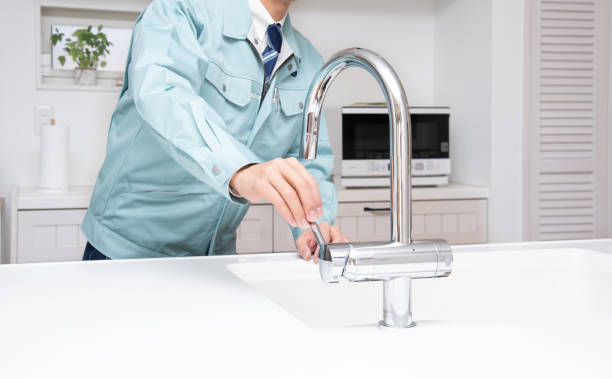 istock Japanese man checking the water in the kitchen 1387985871