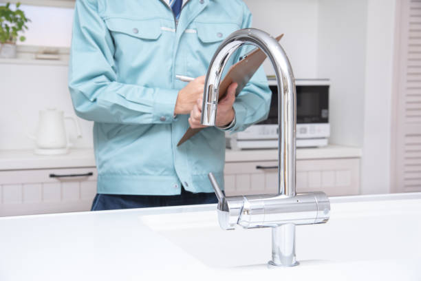 istock Japanese man checking the water in the kitchen 1387985880