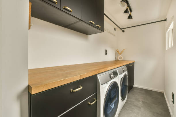 istock Spacious laundry room with appropriate equipment 1387987780