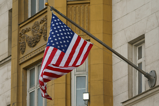 American Stars and Stripes flag on the building in the spring day. Embassy of the United States of America, Moscow