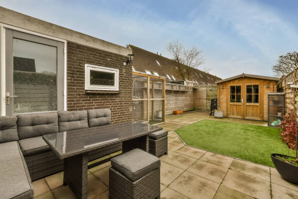 istock Cozy backyard with a seating area and a small lawn 1387988938