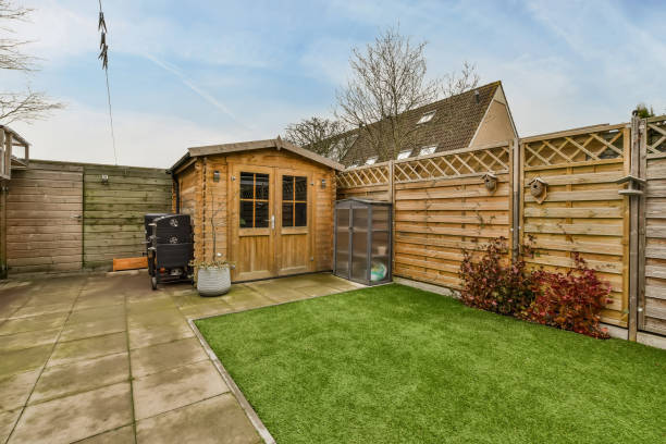 istock Cozy backyard with a small lawn and barbecue equipment 1387989117