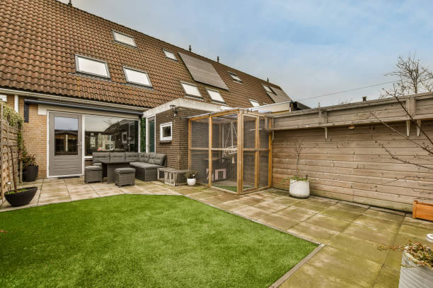 Cozy backyard with a seating area and a small lawn