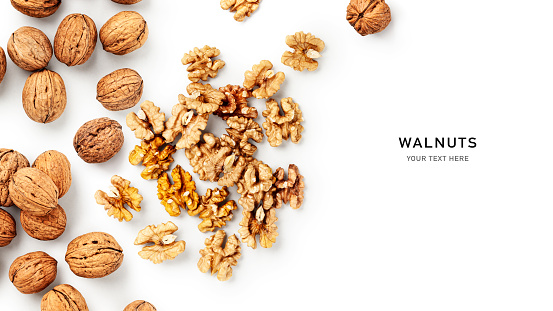 Walnut creative layout isolated on white background. Healthy eating and dieting food concept. Nuts composition and design element. Top view, flat lay