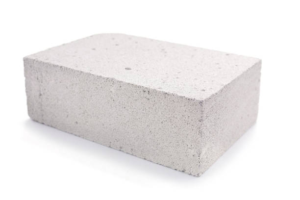 istock Aerated concrete block isolated at white background. Construction brick 1387990703