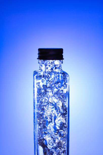 istock Liquids and bubbles in a blueback bottle 1387990825