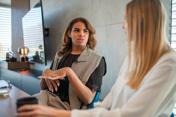 istock Two Diverse Friends Having Conversation At Home 1387993212
