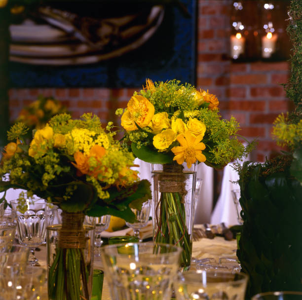 istock Yellow bouquet on wedding table in close up 1387997069