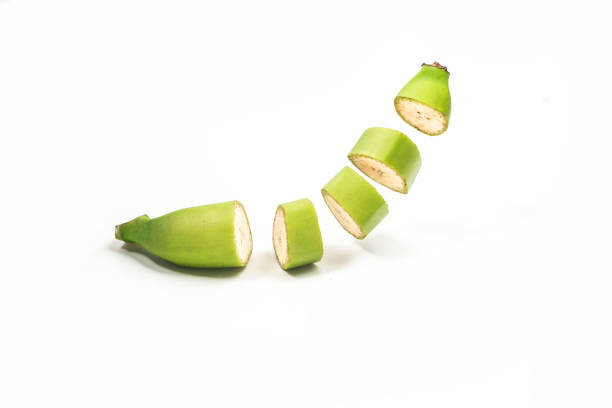 istock Whole bananas and slices are flying close-up on a white background. 1388000077