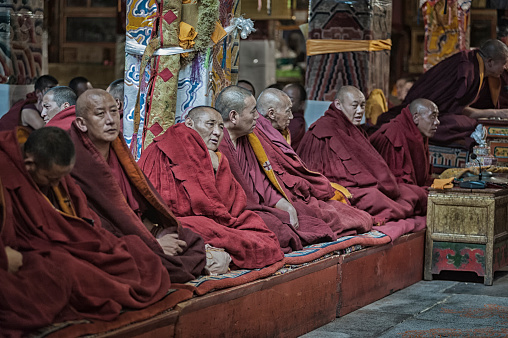 Tibetan monks in the Ganden Monastery located at the top of Wangbur Mountain, Lhasa Tibet