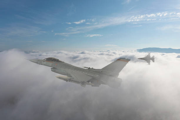 istock Jet fighters flying over the clouds. 1388000450