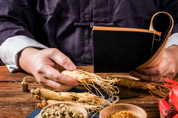 istock A Chinese medicine practitioner is selecting ginseng, traditional Chinese medicine 1388002580