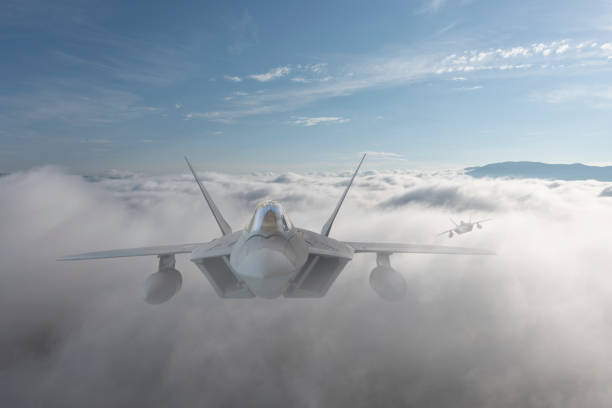 istock Jet fighters flying over the clouds. 1388006494