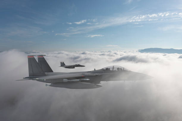 istock Jet fighters flying over the clouds. 1388008405