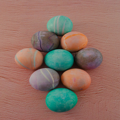Colorful Hard boiled Eggs Flat lay for Easter on pink background.