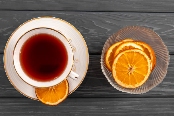 istock Winter composition, scarf and tea with oranges on the table 1388008723