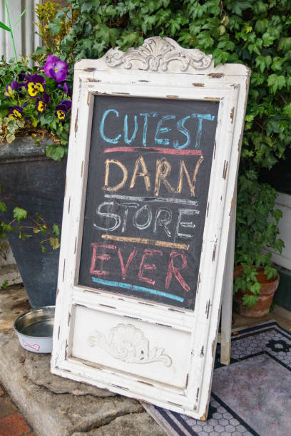 istock Sandwich board chalk sign - cutest darn store ever. 1388010781