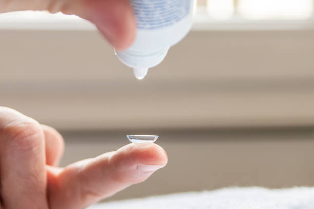 istock Contact lense on finger to correct nearsightedness and blurred vision eyesight by optician or oculist is to handle with hygiene to correct farsightedness with transparent disposable lense macro 1388010996