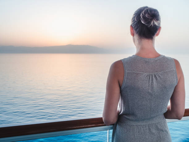 istock Beautiful woman standing on the empty deck 1388011602