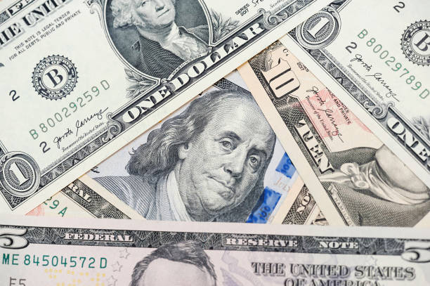 istock American different dollars banknotes wallpaper. Business concept. 1388015848