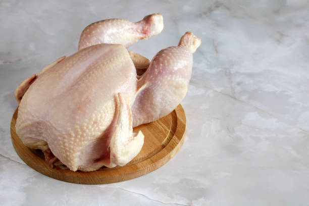 istock plucked chicken, a whole raw carcass of a bird. 1388016190