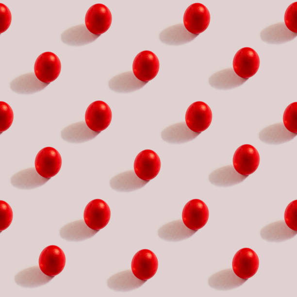 istock Pattern of red eggs on a cream background. The concept of minimal food.Easter eggs. 1388020447
