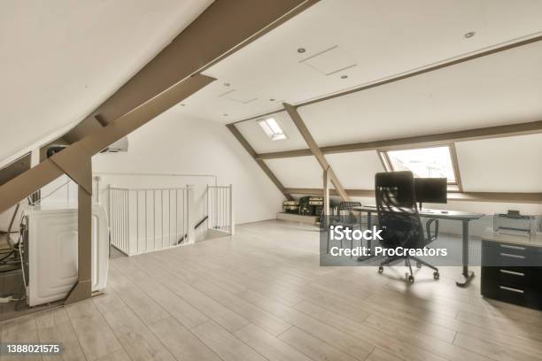 A Working Space In The Attic Of The House Stock Photo - Download Image Now - Attic, Design, Domestic Room