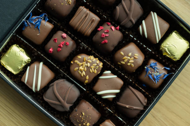 istock Fancy gift box of assorted candies or truffles. 1388021629