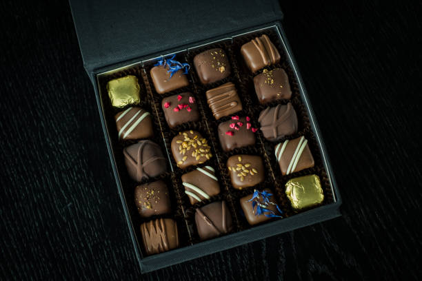 istock Fancy gift box of assorted candies or truffles. 1388021630