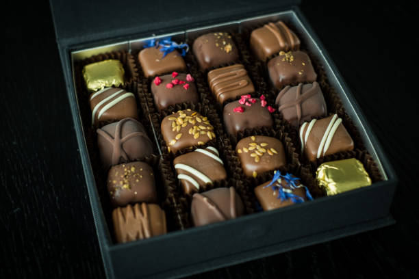 istock Fancy gift box of assorted candies or truffles. 1388021649